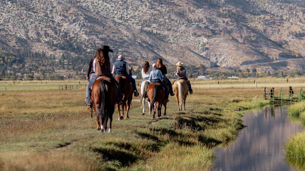 a group of horseback riders with bader ranch trail co in gardnerville nevada
