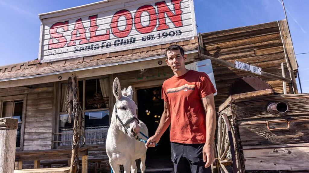 alex honnold and donkey outside sante fe saloon in goldfield