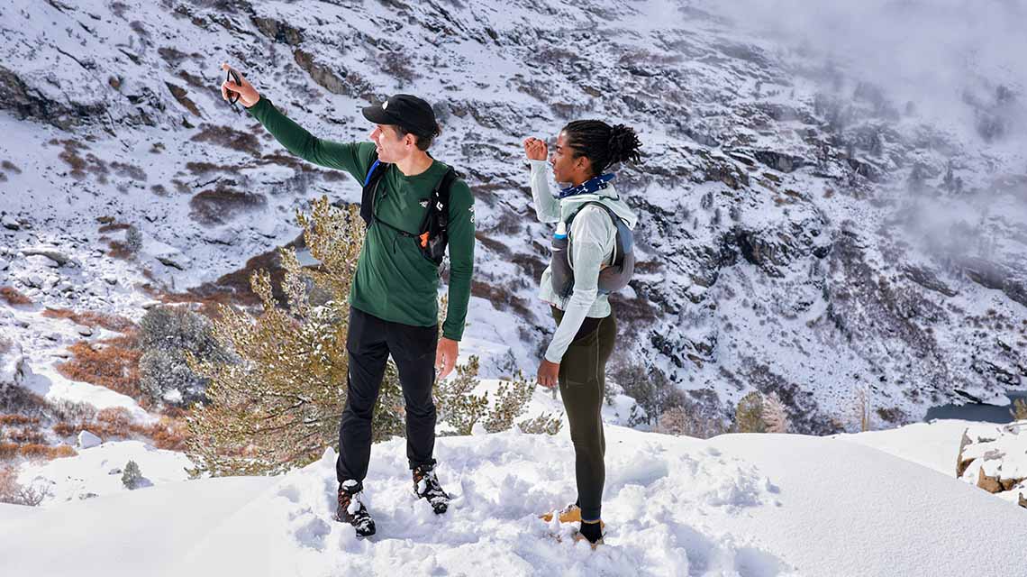 alex honnold atop snowy mountain at angel lake in northern nevada